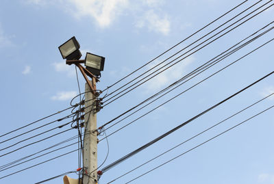 Low angle view of power line against sky