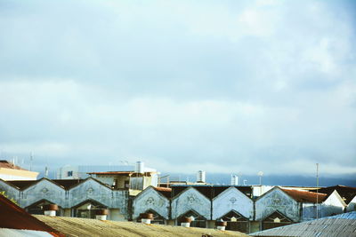 High section of building against cloudy sky