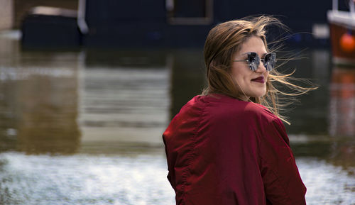 Young woman wearing sunglasses standing outdoors