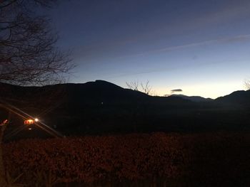 Scenic view of mountains against sky at night