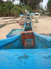 Close-up of boat on shore