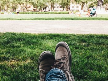 Low section of men on grass