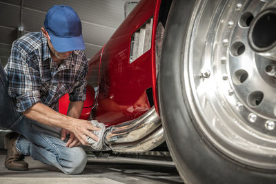 Midsection of man working in workshop