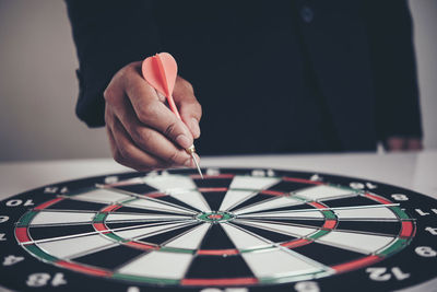 Close-up of hand holding umbrella