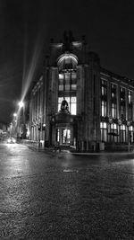 Rear view of illuminated building at night