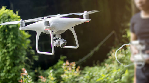 Close-up of airplane flying against blurred background