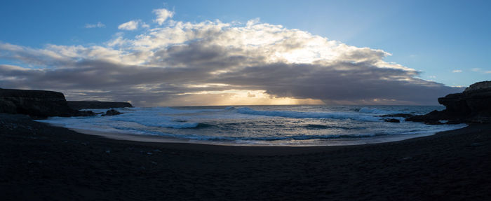 Scenic view of beach against sky