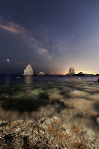 Scenic view of sea against sky at night