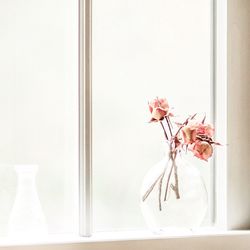 Close-up of vase on window sill