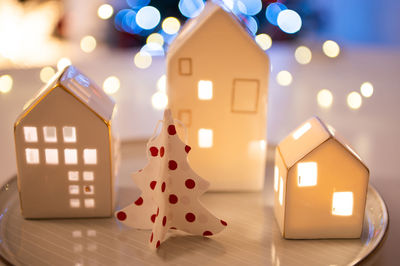 Close-up of illuminated christmas decorations on table