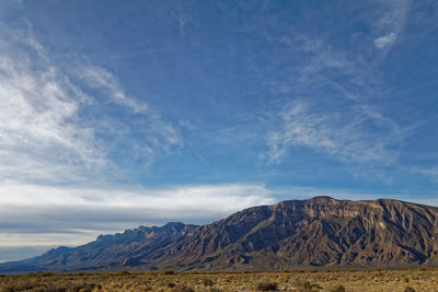 View of mountain range against cloudy sky