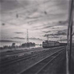 Railroad tracks seen through train windshield