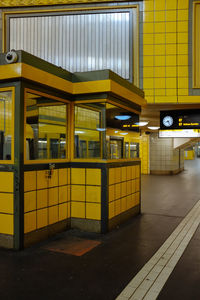 Illuminated subway station platform in city