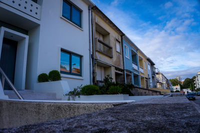 Houses against sky in city