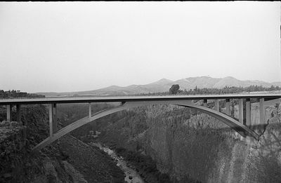 Bridge over river against clear sky