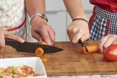 Midsection of woman preparing food