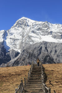 Steps on mountain against clear sky during winter