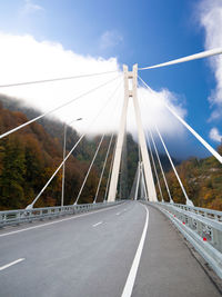 Bridge over road against sky