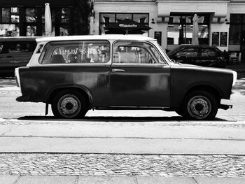 Vintage car parked on city street