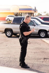 Side view of man walking on street