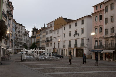 People walking on street in city