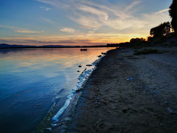 Scenic view of sea against sky at sunset