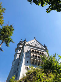 Low angle view of building against clear blue sky