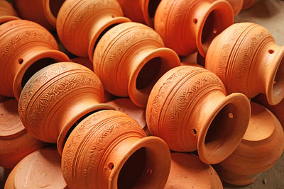 Rows of orange brown unglazed clayware, famous mon style's koh kret pottery, thailand