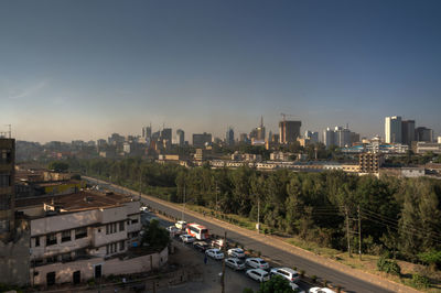 High angle view of city buildings against sky