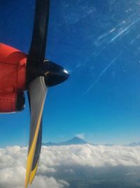 Low angle view of airplane flying in sky