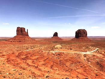 Scenic view of arid landscape against sky