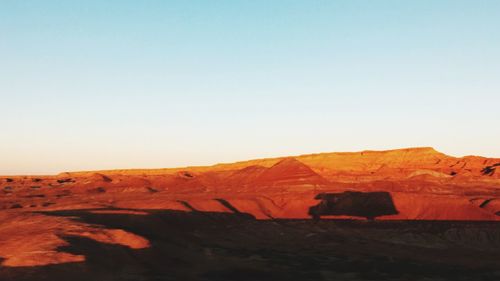 View of a desert against clear sky