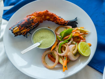 High angle view of fruits in plate on table