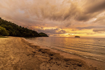 Scenic view of beach against sky during sunset