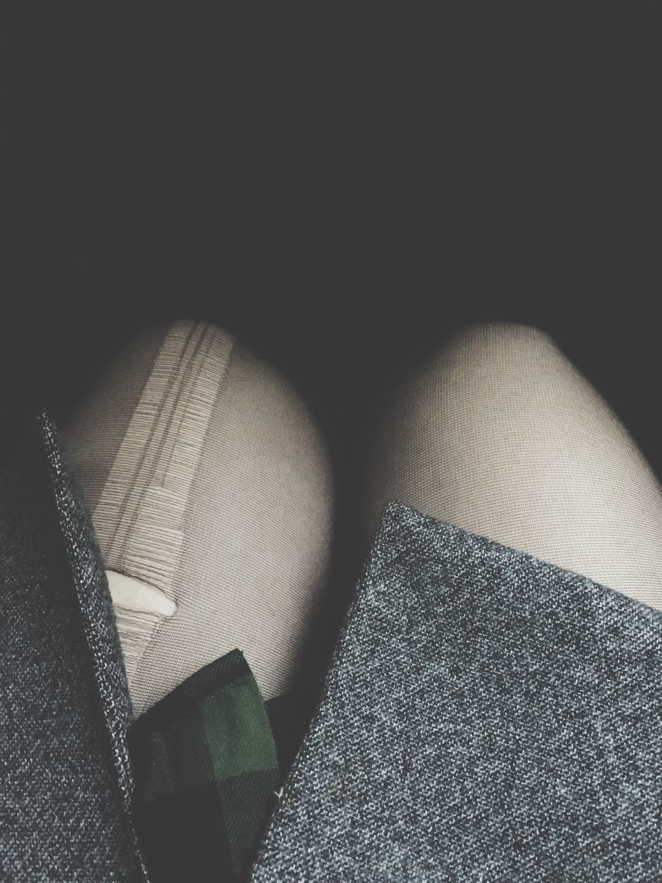 LOW SECTION OF WOMAN WEARING SHOES ON FLOOR