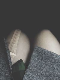 Low section of woman relaxing on floor