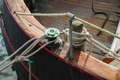 Detailed close up detail of ropes and cordage in the rigging of an old wooden vintage sailboat.