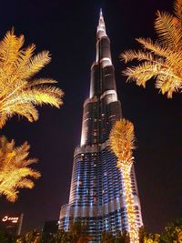 Low angle view of illuminated buildings at night