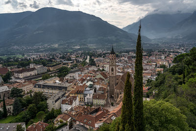 High angle view of townscape and mountains