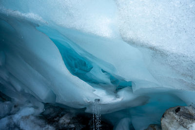 Low section of person skiing in sea