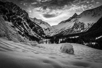 Scenic view of snow covered mountains against sky