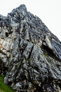 Low angle view of rock formation against clear sky