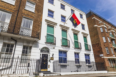 Embassy of angola in london, official building with national flag. london, uk, 14 april 2024