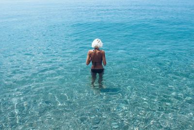 Full length of woman swimming in sea