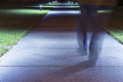 Low section of people walking on footpath