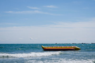 Boat in sea against sky