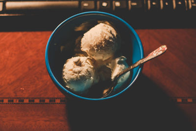 High angle view of fresh ice cream in blue bowl on table