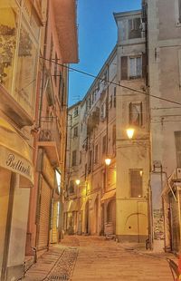 Illuminated street lights in city at night