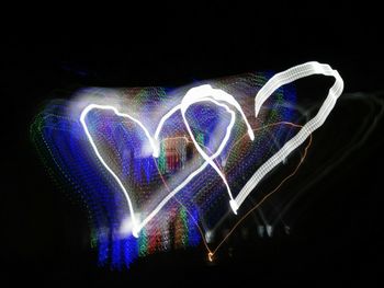 Illuminated heart shape at night