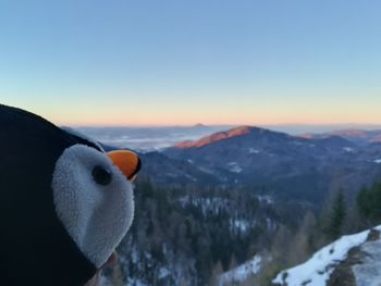 High angle view of snowcapped mountain against sky during sunset